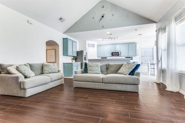 living room featuring arched walkways, visible vents, high vaulted ceiling, and dark wood-type flooring