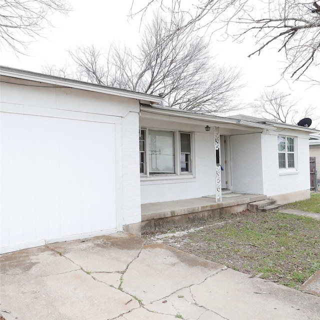 view of front of property with a porch and brick siding