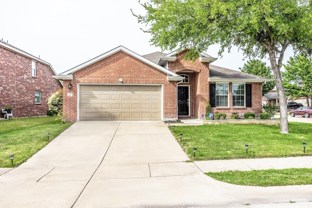 view of front of property featuring a garage, brick siding, driveway, and a front lawn