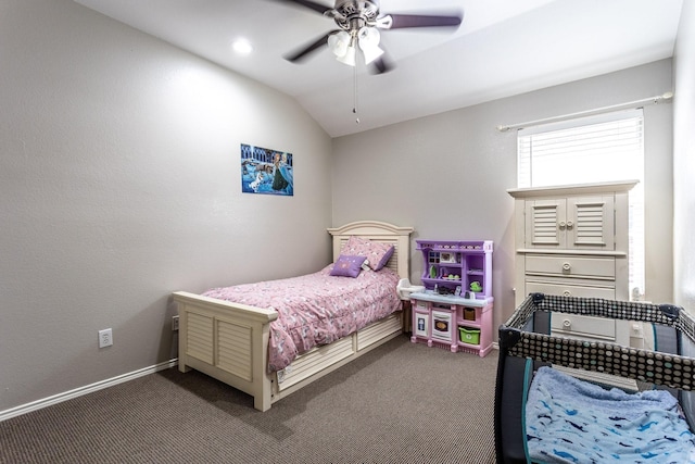 bedroom with lofted ceiling, dark carpet, a ceiling fan, and baseboards