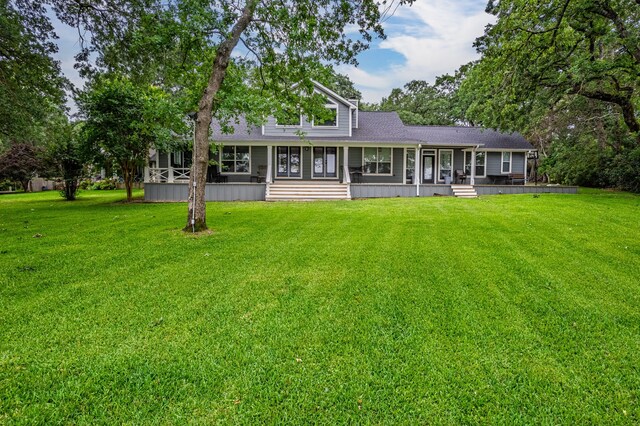 7811 Double Oaks Rd, Athens, TX 75752 - back of house featuring covered porch, a yard, and roof with shingles