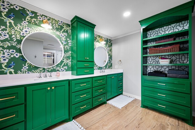 7811 Double Oaks Rd, Athens, TX 75752 - full bathroom with wood finished floors, double vanity, ornamental molding, and wallpapered walls