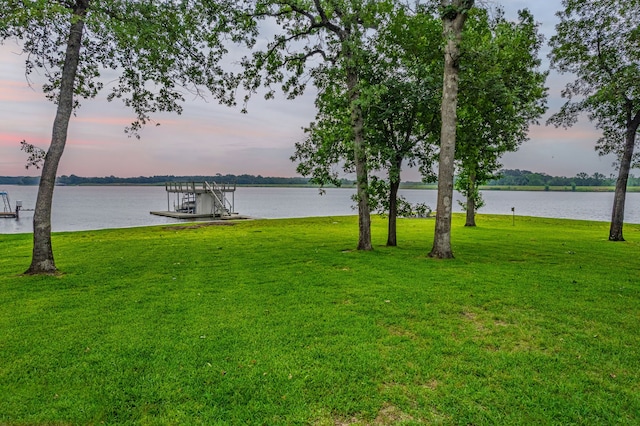 7811 Double Oaks Rd, Athens, TX 75752 - yard at dusk featuring a boat dock, a yard, and a water view