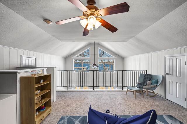 7811 Double Oaks Rd, Athens, TX 75752 - living area with ceiling fan, carpet, a textured ceiling, and lofted ceiling