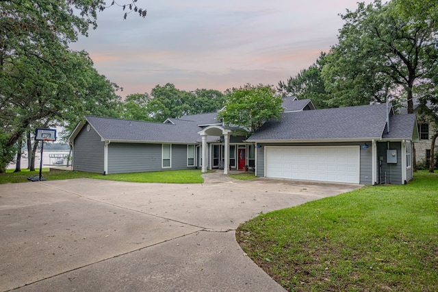 7811 Double Oaks Rd, Athens, TX 75752 - view of front of home with driveway, a lawn, a garage, and a shingled roof