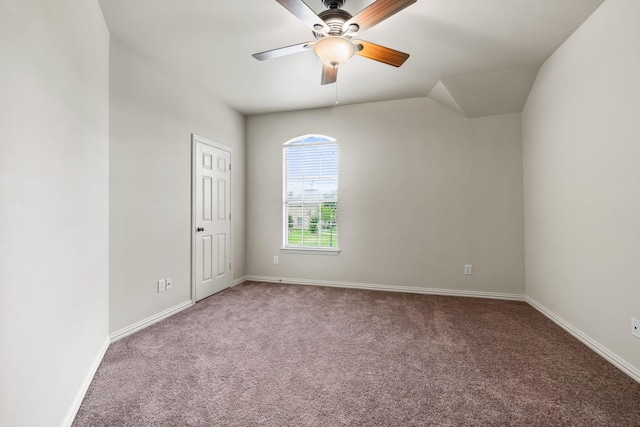 spare room with carpet, a ceiling fan, and baseboards