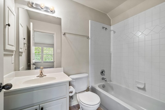 bathroom with  shower combination, vanity, and toilet