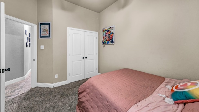 carpeted bedroom with baseboards, a closet, and french doors