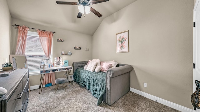 carpeted bedroom with lofted ceiling, baseboards, and a ceiling fan