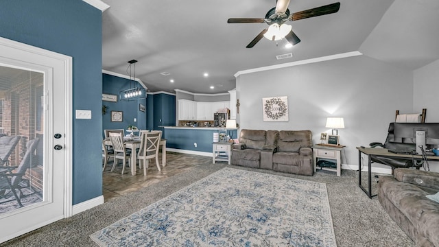 living room with visible vents, crown molding, and baseboards