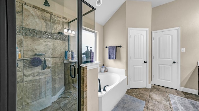 full bathroom featuring tile patterned flooring, a shower stall, vaulted ceiling, and a bath