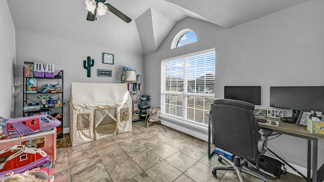 tiled office featuring vaulted ceiling and a ceiling fan