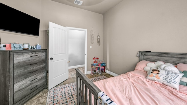 bedroom with visible vents and baseboards