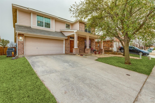 view of front facade featuring an attached garage, a front lawn, concrete driveway, and brick siding