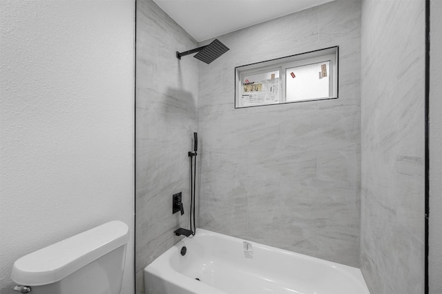 bathroom with shower / bath combination and toilet