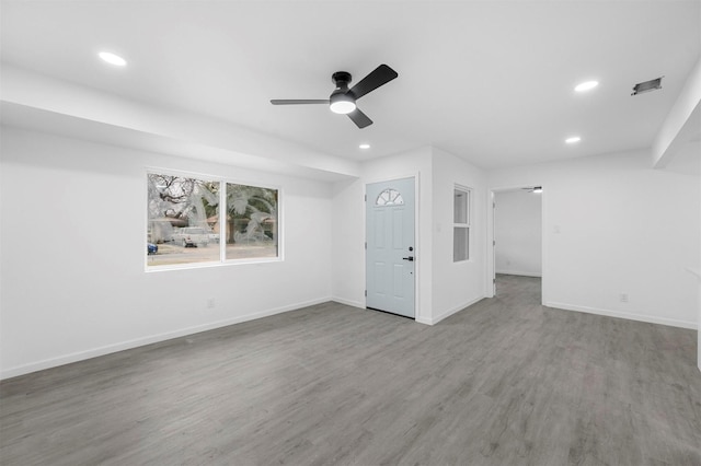 empty room featuring a ceiling fan, recessed lighting, baseboards, and wood finished floors