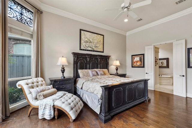 bedroom with ensuite bathroom, dark wood-type flooring, visible vents, and crown molding