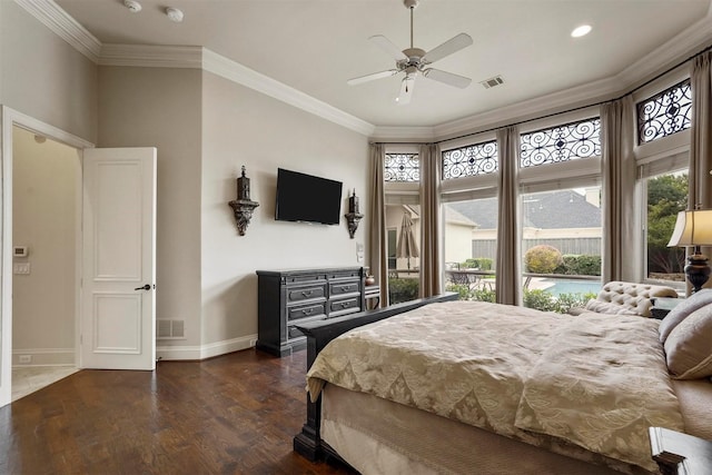 bedroom featuring visible vents, crown molding, and wood finished floors