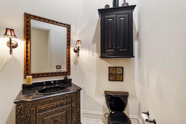 bathroom featuring vanity and baseboards