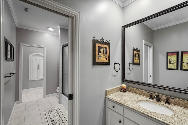 full bathroom featuring crown molding, visible vents, toilet, vanity, and tile patterned floors