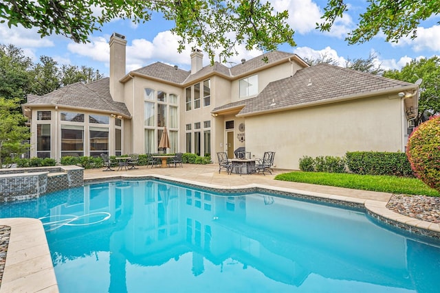 pool with a patio area