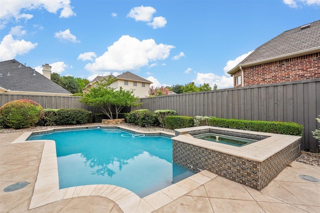 view of swimming pool featuring a fenced backyard, a patio, a fenced in pool, and an in ground hot tub