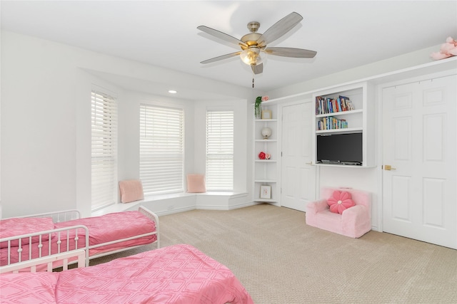 bedroom featuring carpet, baseboards, and a ceiling fan