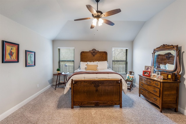 bedroom featuring light carpet, ceiling fan, baseboards, and vaulted ceiling