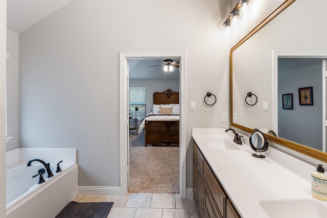 bathroom featuring ensuite bathroom, tile patterned flooring, a garden tub, a sink, and double vanity