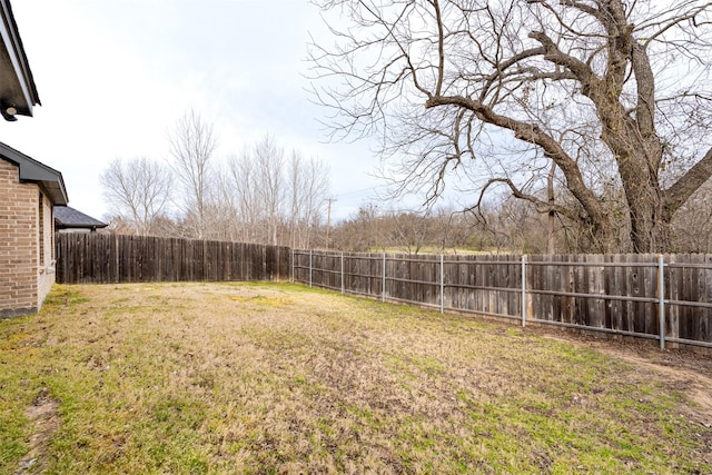 view of yard featuring a fenced backyard