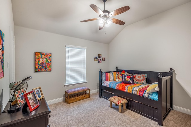 carpeted bedroom with lofted ceiling, ceiling fan, and baseboards