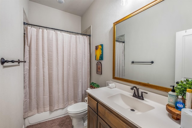 full bath featuring shower / bath combo, vanity, and toilet