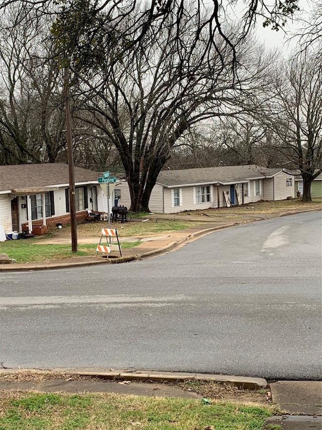 view of street featuring curbs