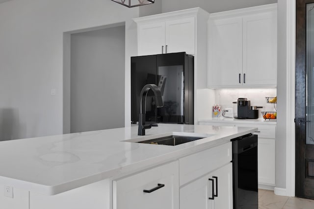 kitchen featuring a sink, white cabinetry, marble finish floor, backsplash, and black appliances