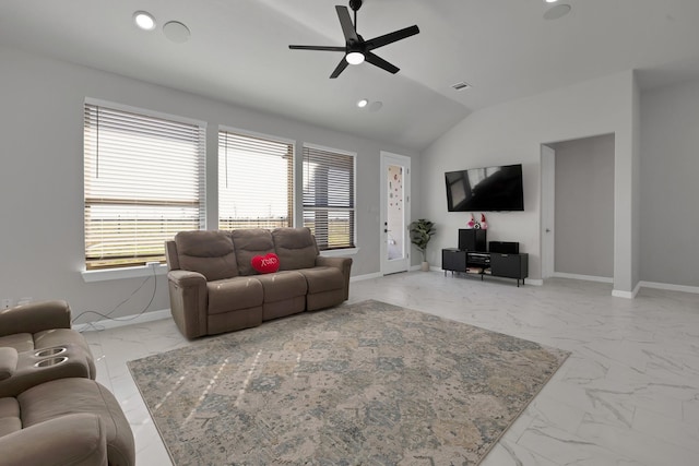 living area with vaulted ceiling, marble finish floor, and baseboards