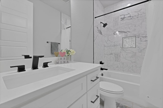 full bath with marble finish floor, vanity, toilet, and shower / bath combo with shower curtain