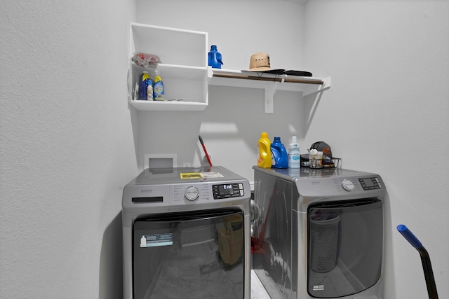 laundry area featuring laundry area and washing machine and clothes dryer