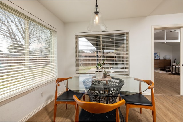 dining room with wood finished floors and baseboards