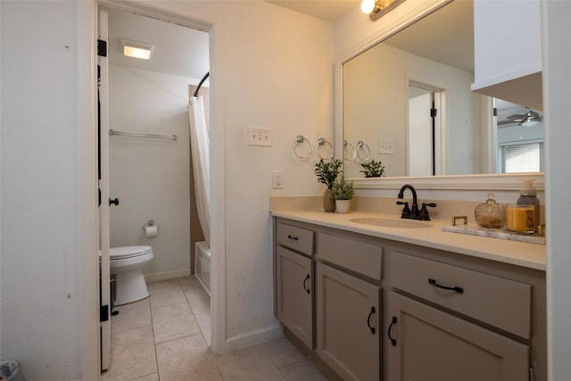 full bath featuring shower / tub combo with curtain, toilet, a ceiling fan, vanity, and tile patterned flooring