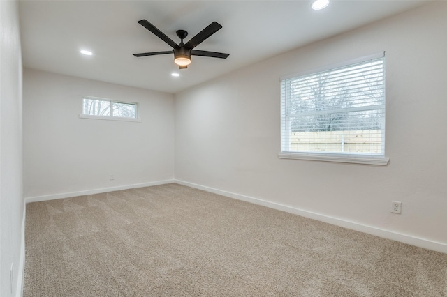 carpeted spare room featuring baseboards, ceiling fan, and recessed lighting