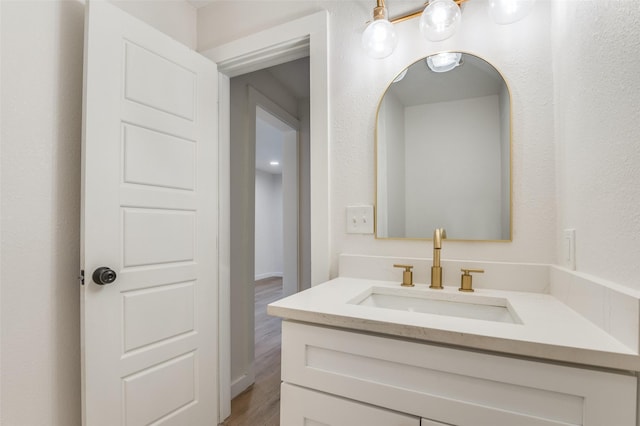 bathroom featuring vanity and wood finished floors