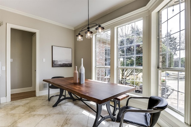 dining space with crown molding, baseboards, and light tile patterned floors