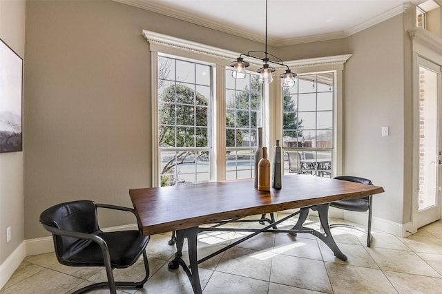 dining space featuring baseboards, light tile patterned floors, and crown molding