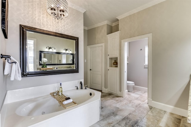 bathroom with a chandelier, toilet, baseboards, a tub with jets, and crown molding