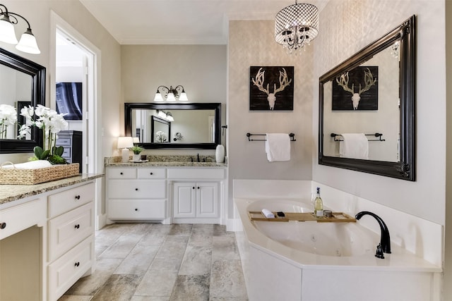 full bathroom featuring ornamental molding, vanity, and a tub with jets