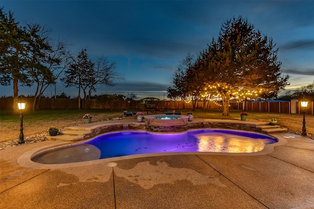 view of swimming pool with a fenced backyard, a patio, a lawn, and an in ground hot tub