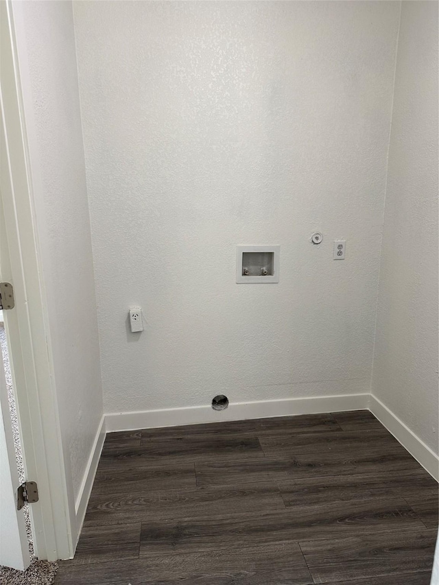 washroom with baseboards, hookup for an electric dryer, dark wood finished floors, and hookup for a washing machine