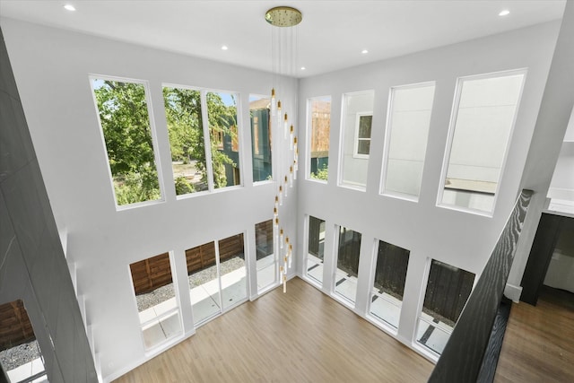 interior space with wood finished floors and recessed lighting