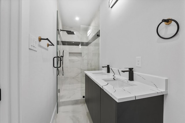 full bath featuring marble finish floor, a marble finish shower, and a sink