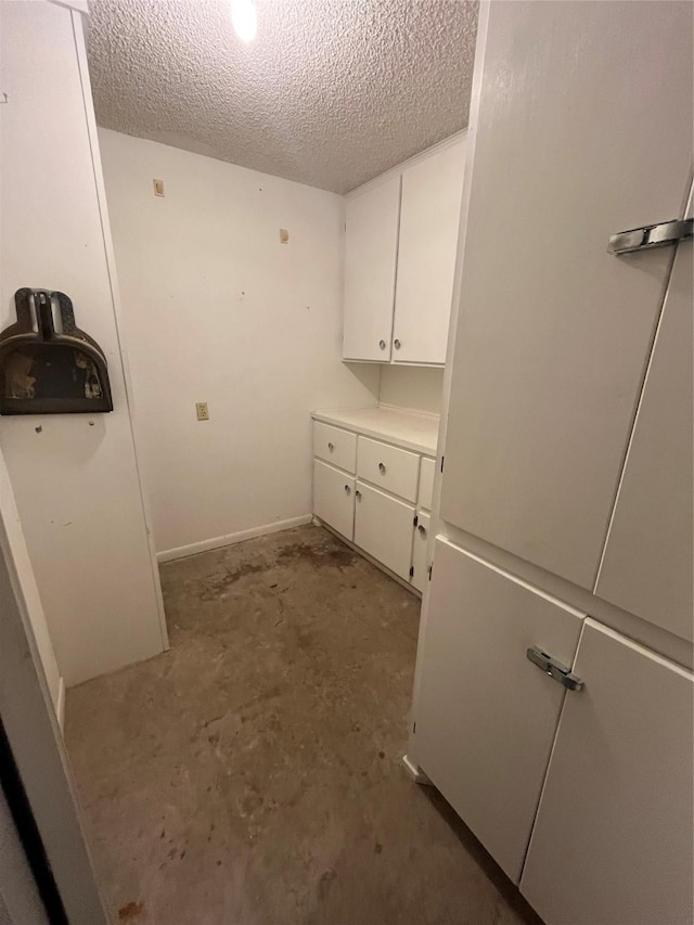 washroom featuring a textured ceiling